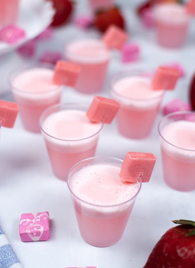 pink shots in cups with starburst candy on side