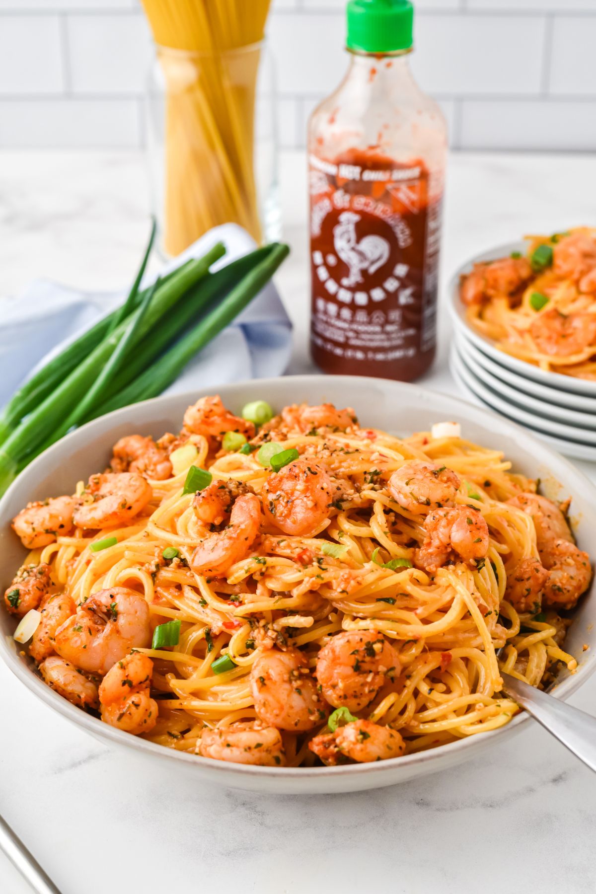 large bowl with shrimp pasta and fork