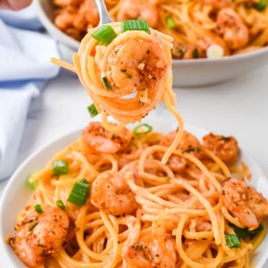 bang bang shrimp on fork with pasta