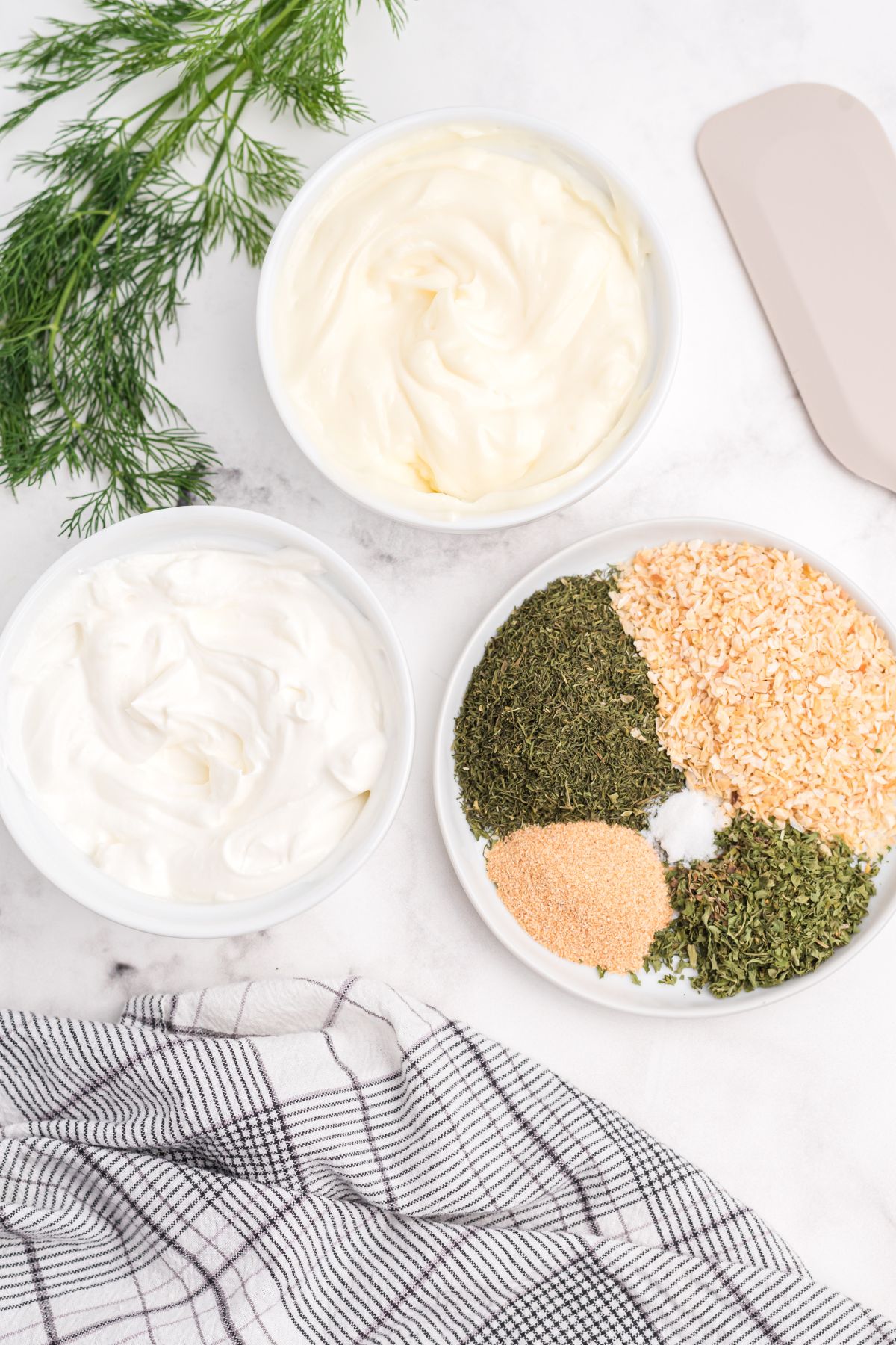 dill dip ingredients on counter with seasonings all one one plate
