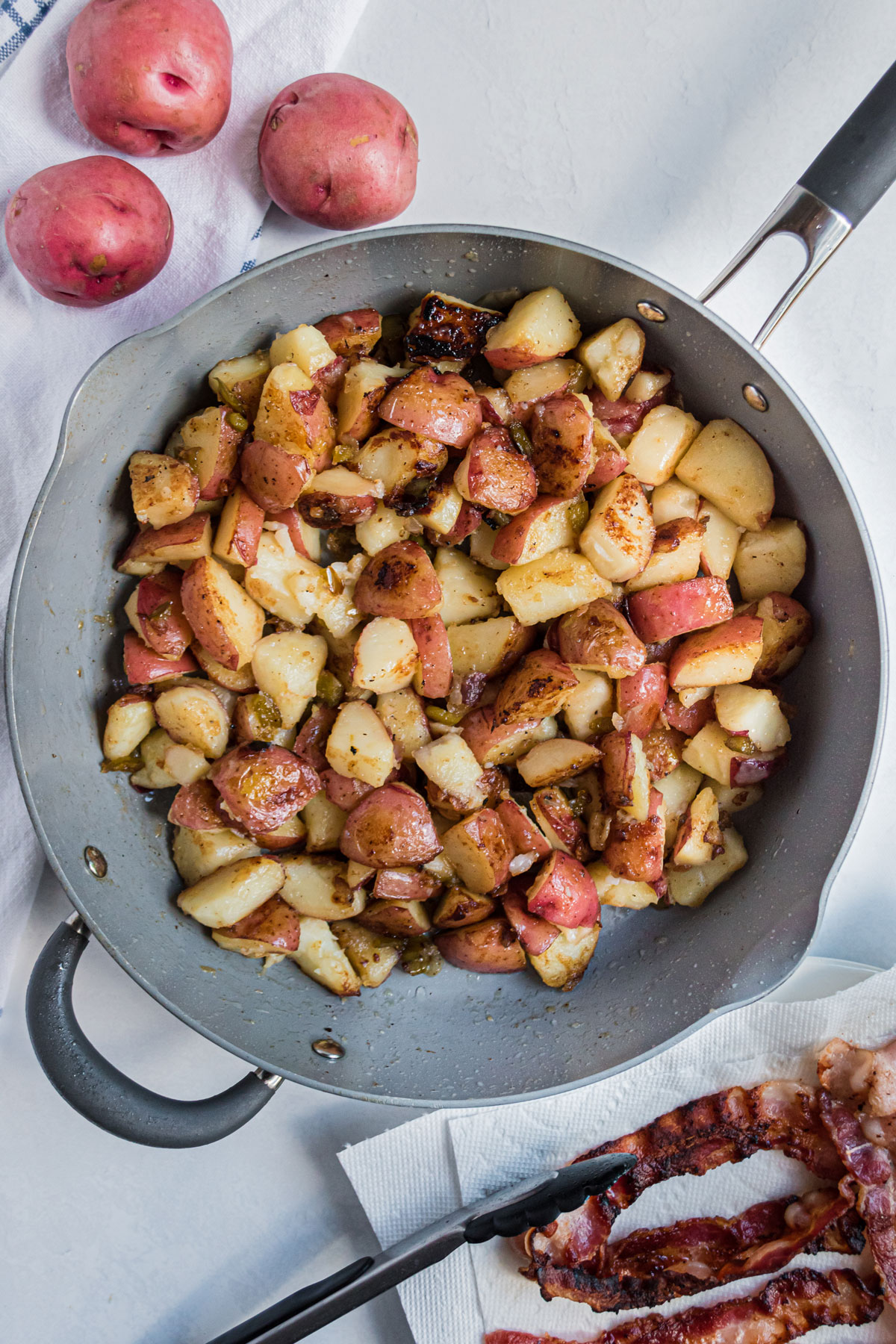 One process of preparing Hot German Potato Salad is to brown the potatoes