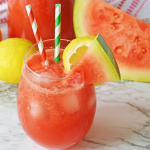 pink watermelon juice in stemless glass with straws