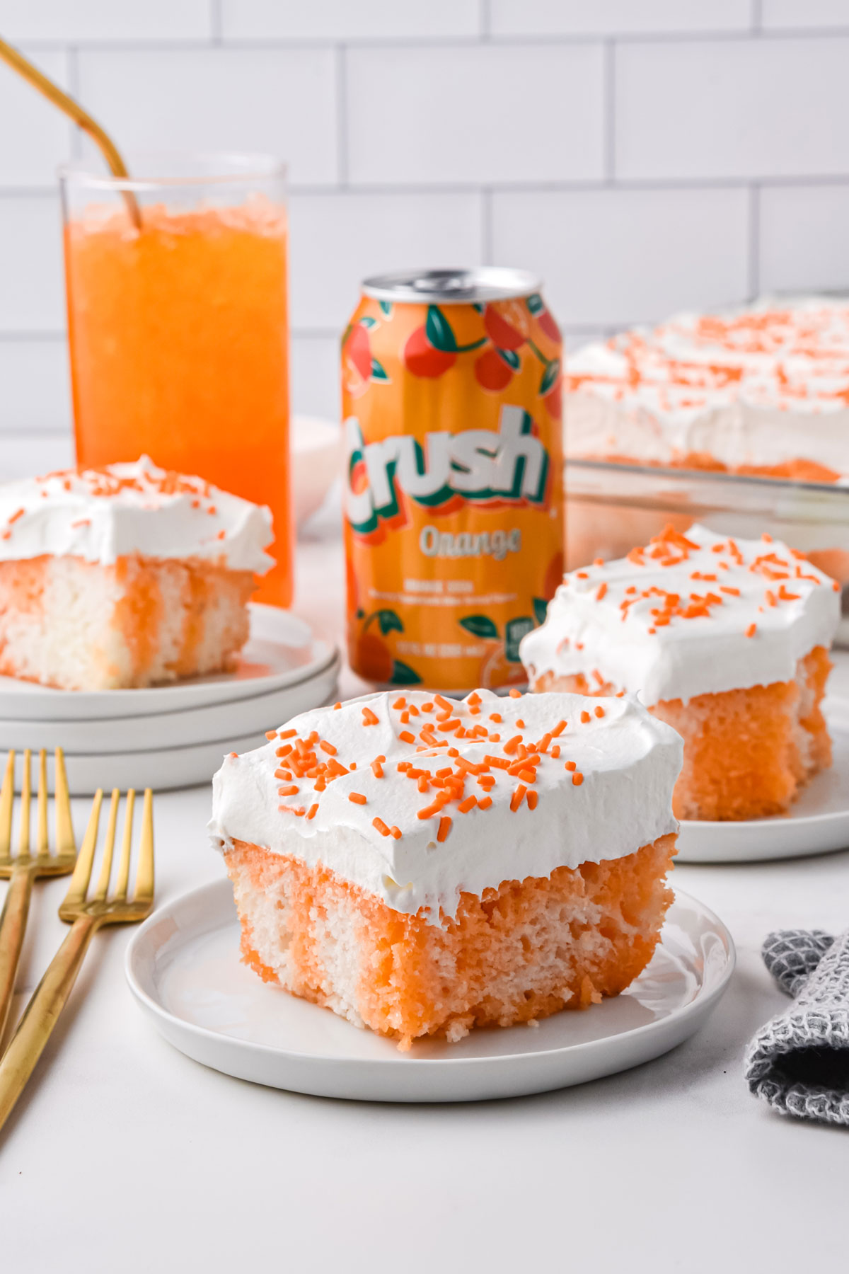 A slice of Orange Crush Poke Cake