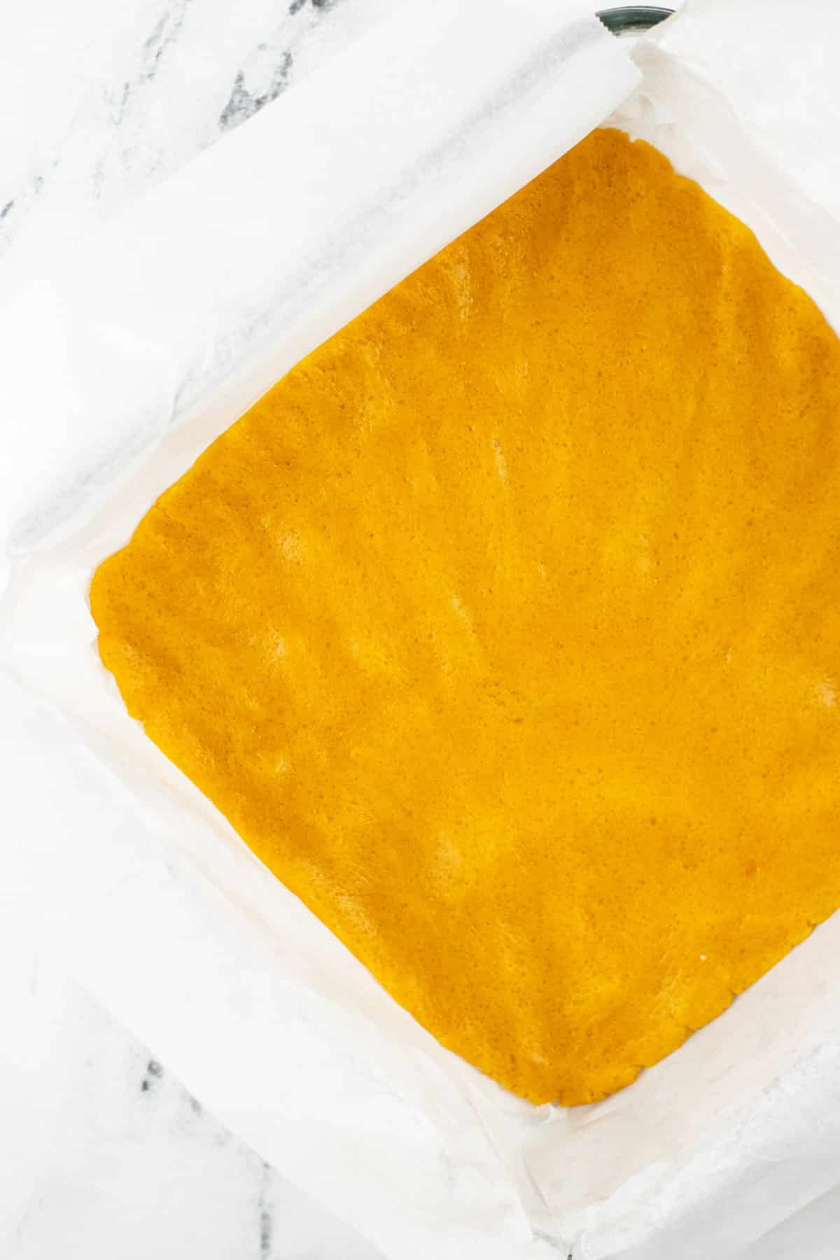 Flattened yellow dough for Candy Corn Cookie Bars