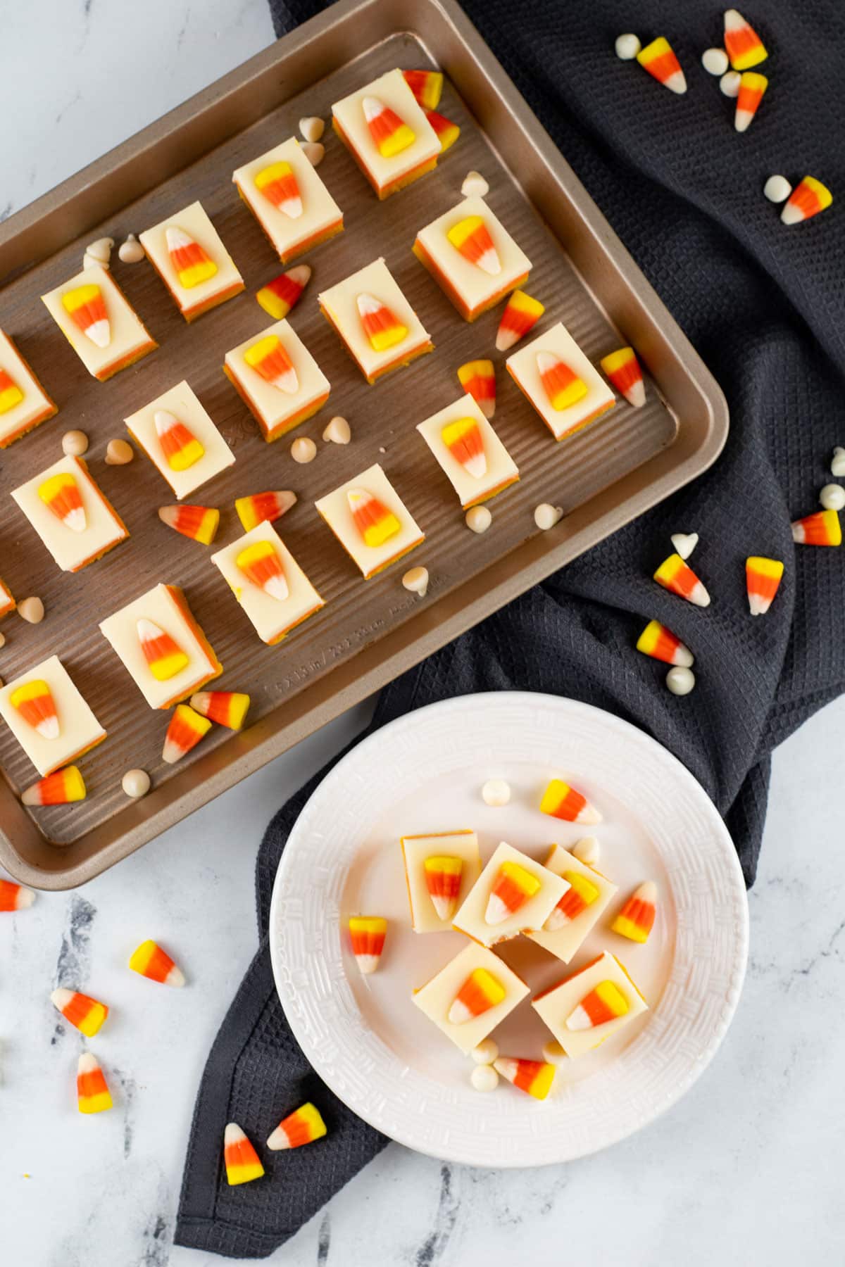 candy corns on top of fudge squares on sheet pan