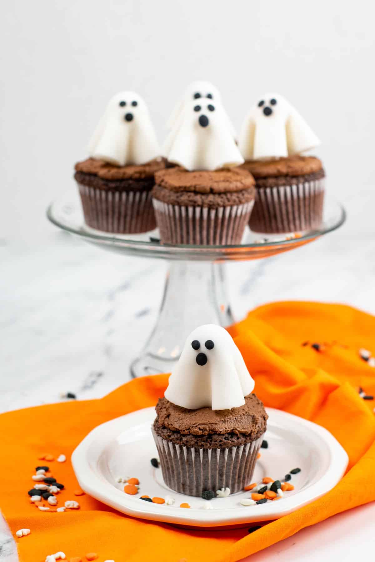 Ghost Cupcakes on a Halloween themed table