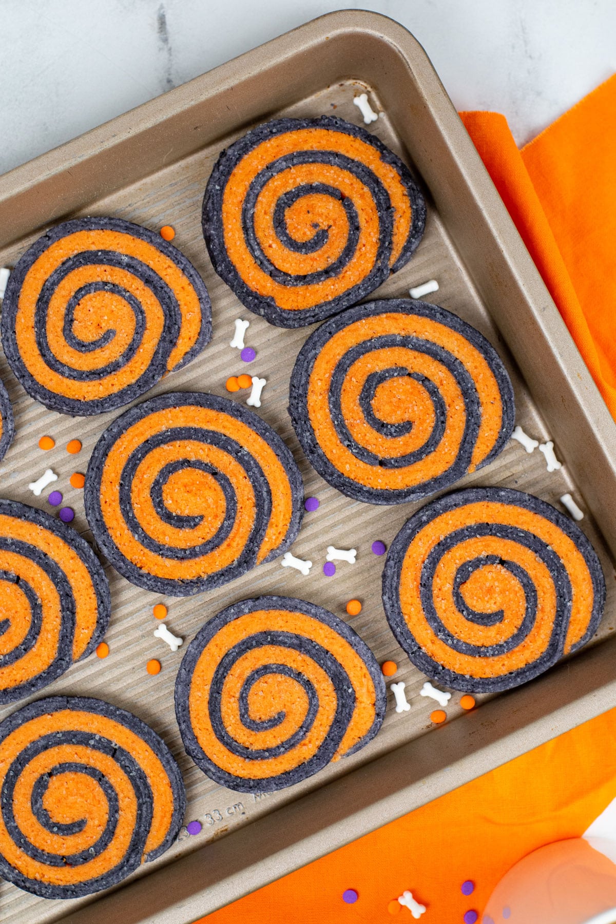 A tray of halloween pinwheel cookies