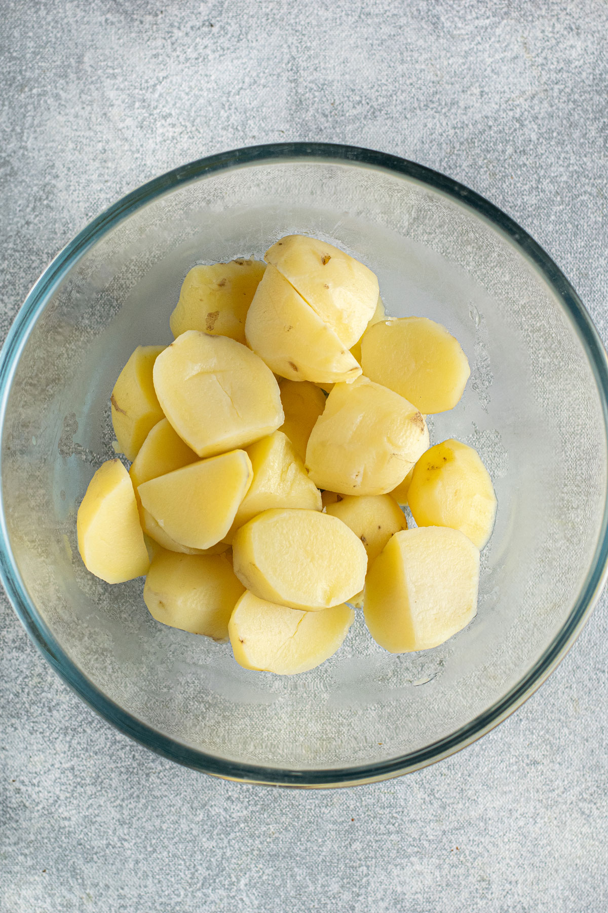 Drained boiled potatoes for Instant Pot Garlic Mashed Potatoes recipe