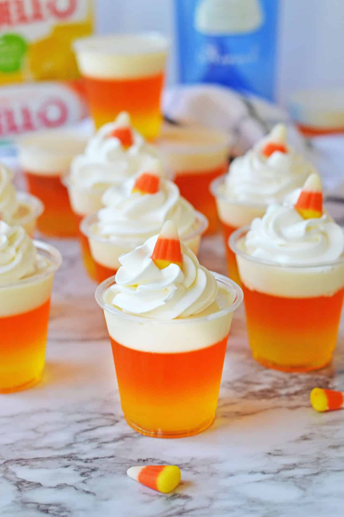 Candy corn jello shots on a marble counter