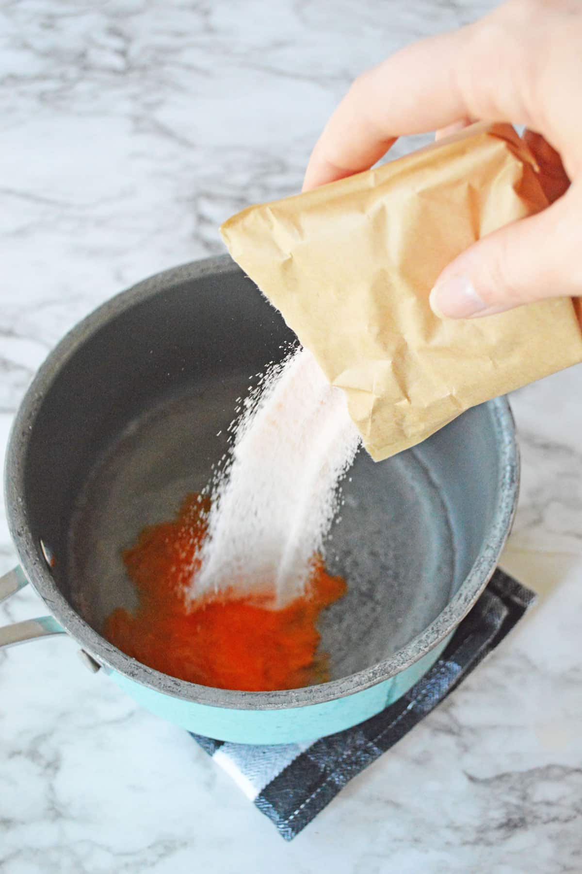 Dissolving orange jello for Candy Corn Jello Shots