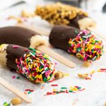 banana popsicles with sprinkles and nuts