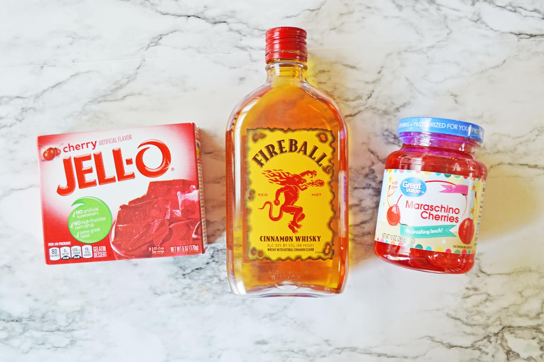 Ingredients for Cherry Fireball Jello Shots includes Jell-), Cinnamon whisky, and cherries