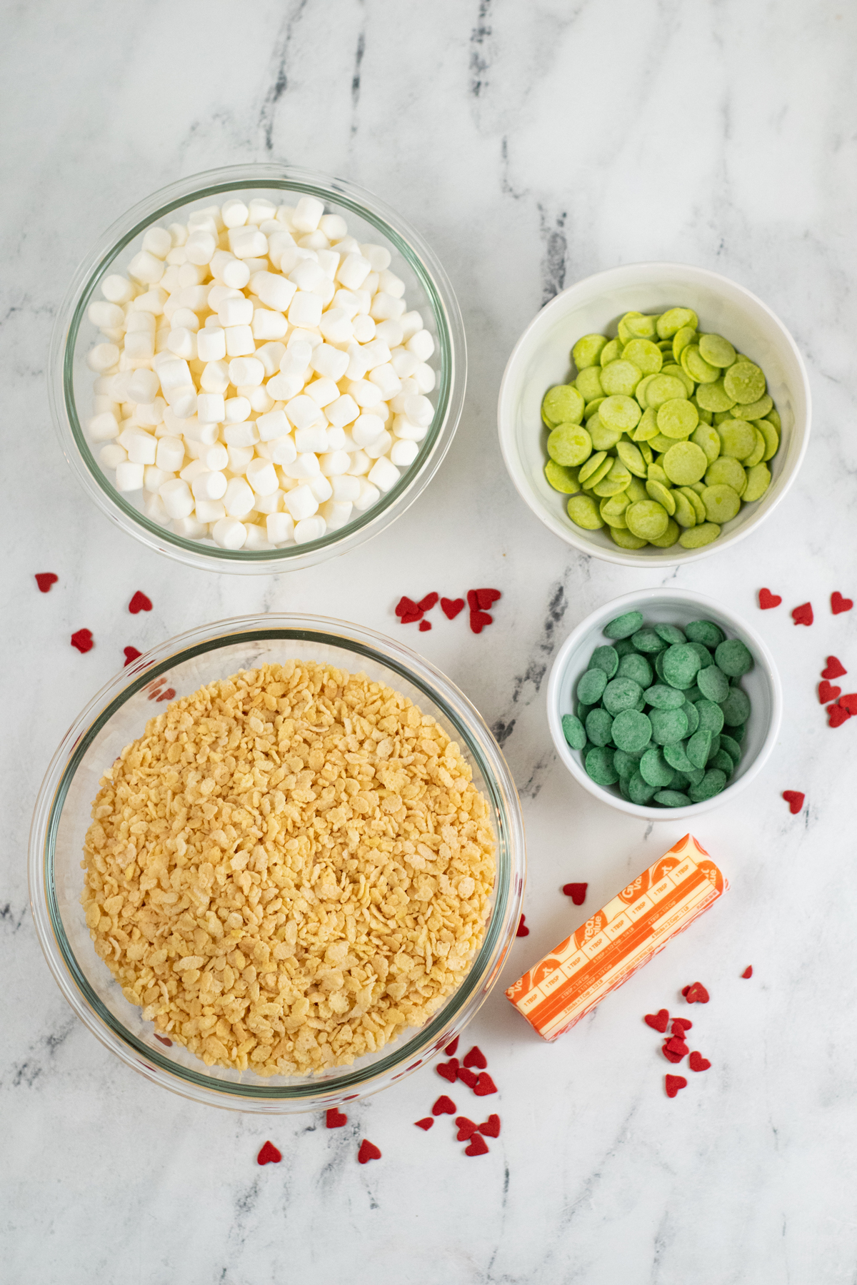 Ingredients for Grinch Rice Krispie Treats. This includes Rice Krispies Cereal , marshmallows, candy melts and sprinkles