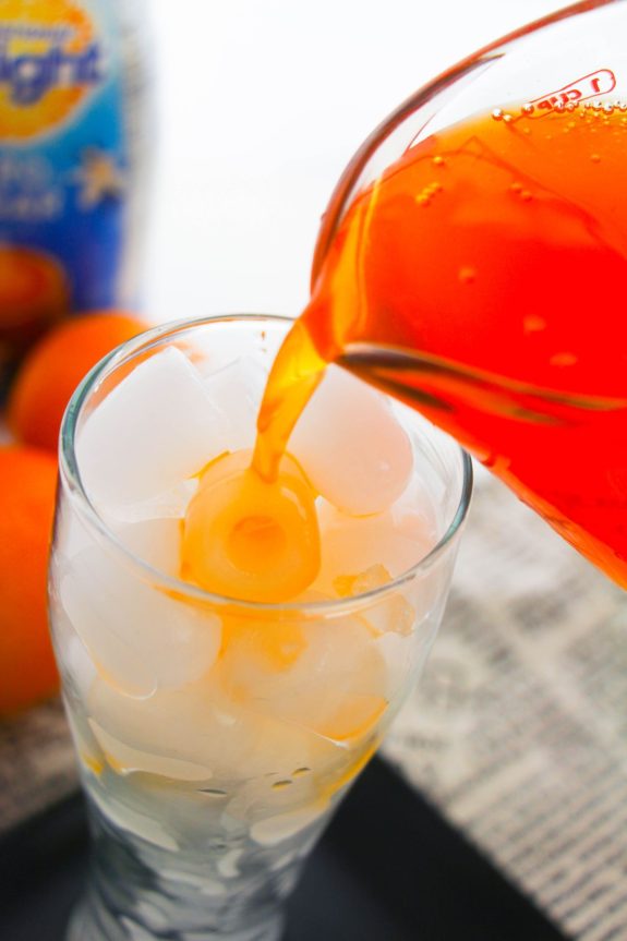 pouring orange soda