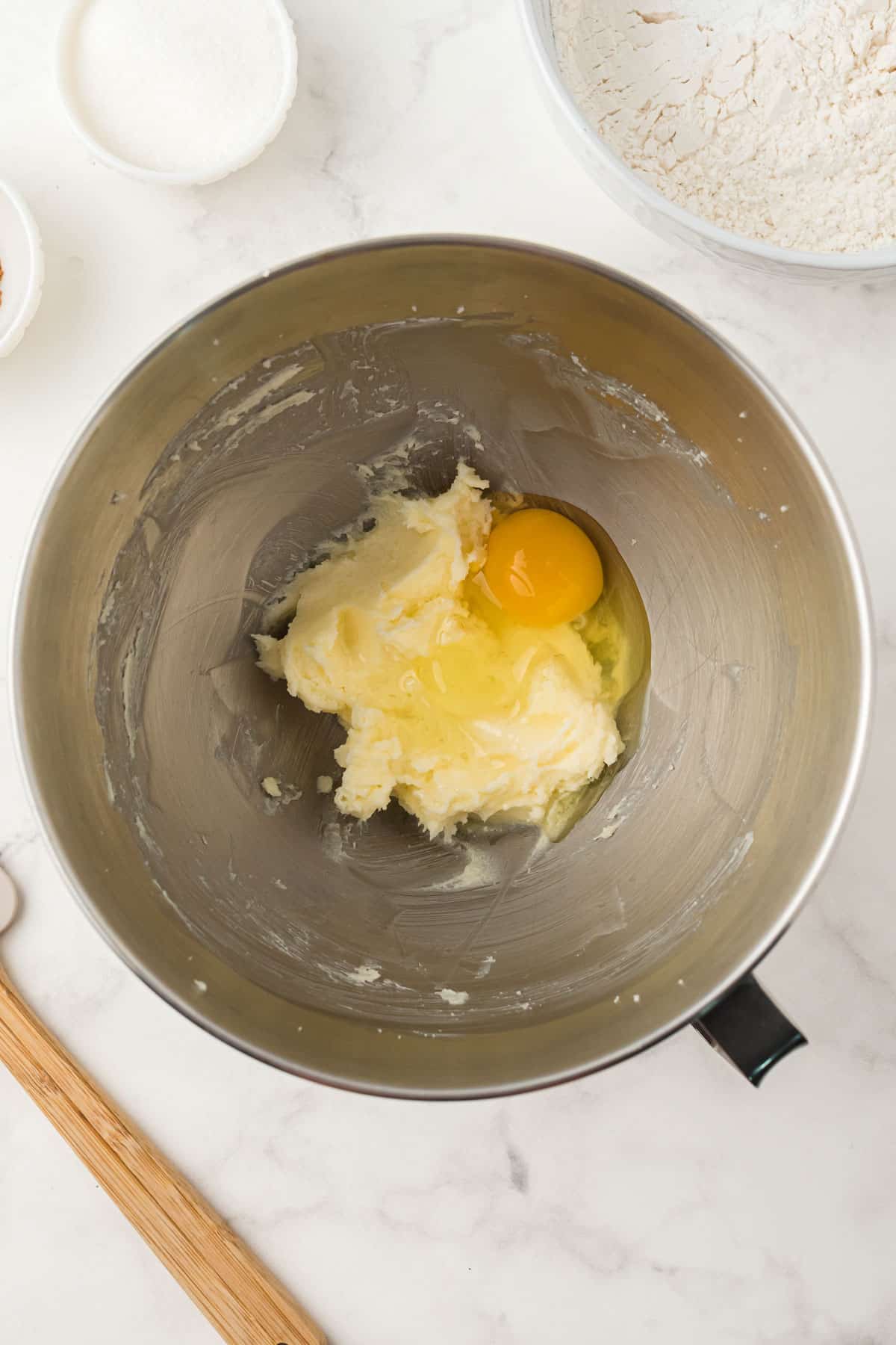 Melted butter and egg in a mixing bowl for Snickerdoodle
