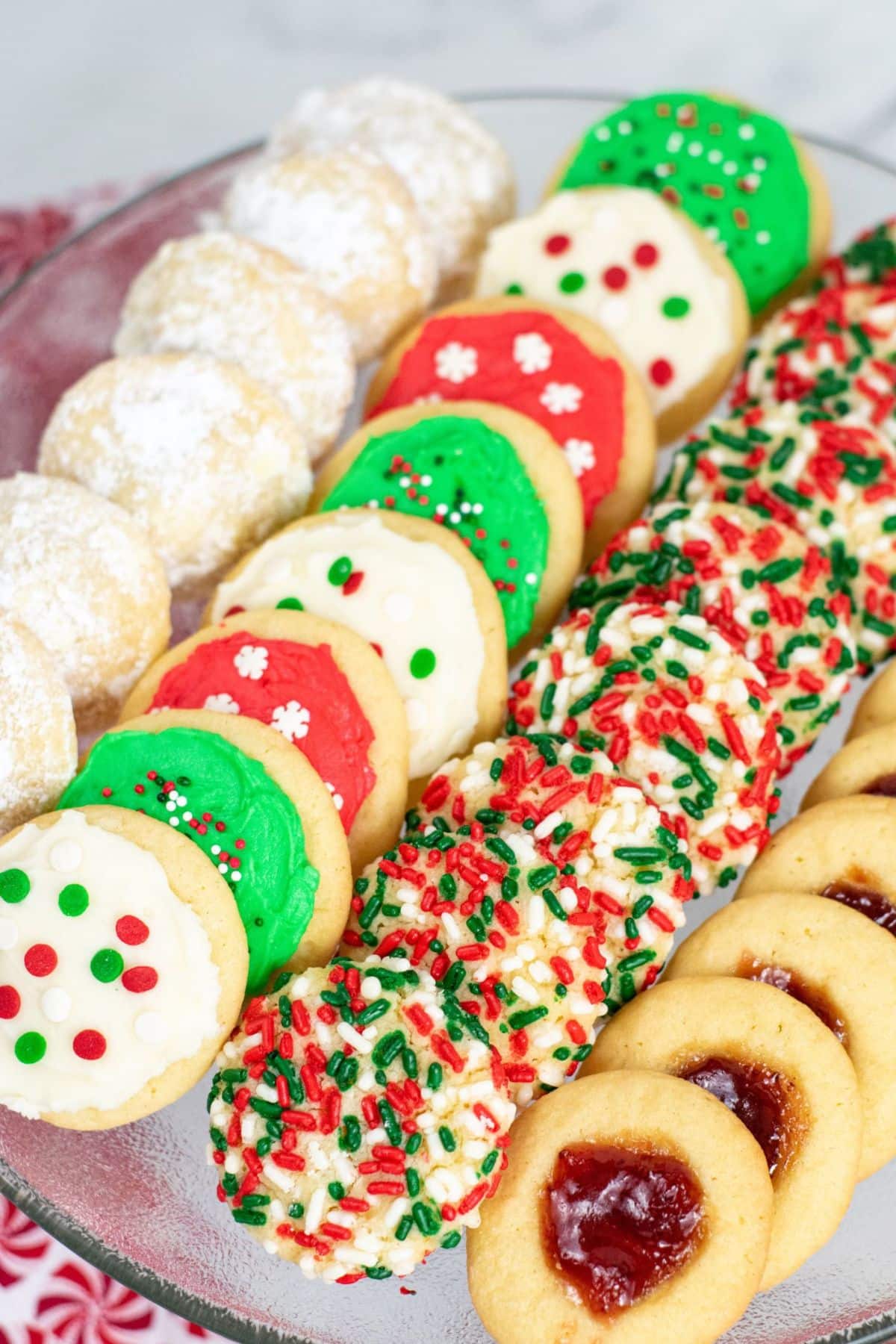 four different Christmas cookies on tray