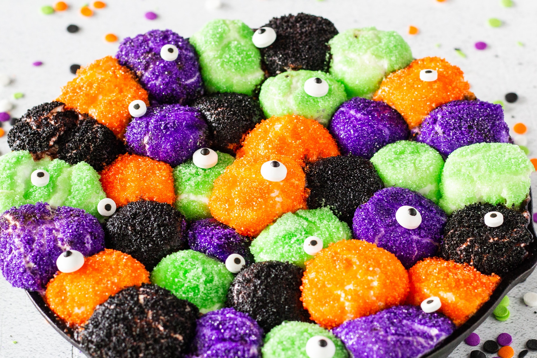 A skillet of Halloween smores dip with candy eye