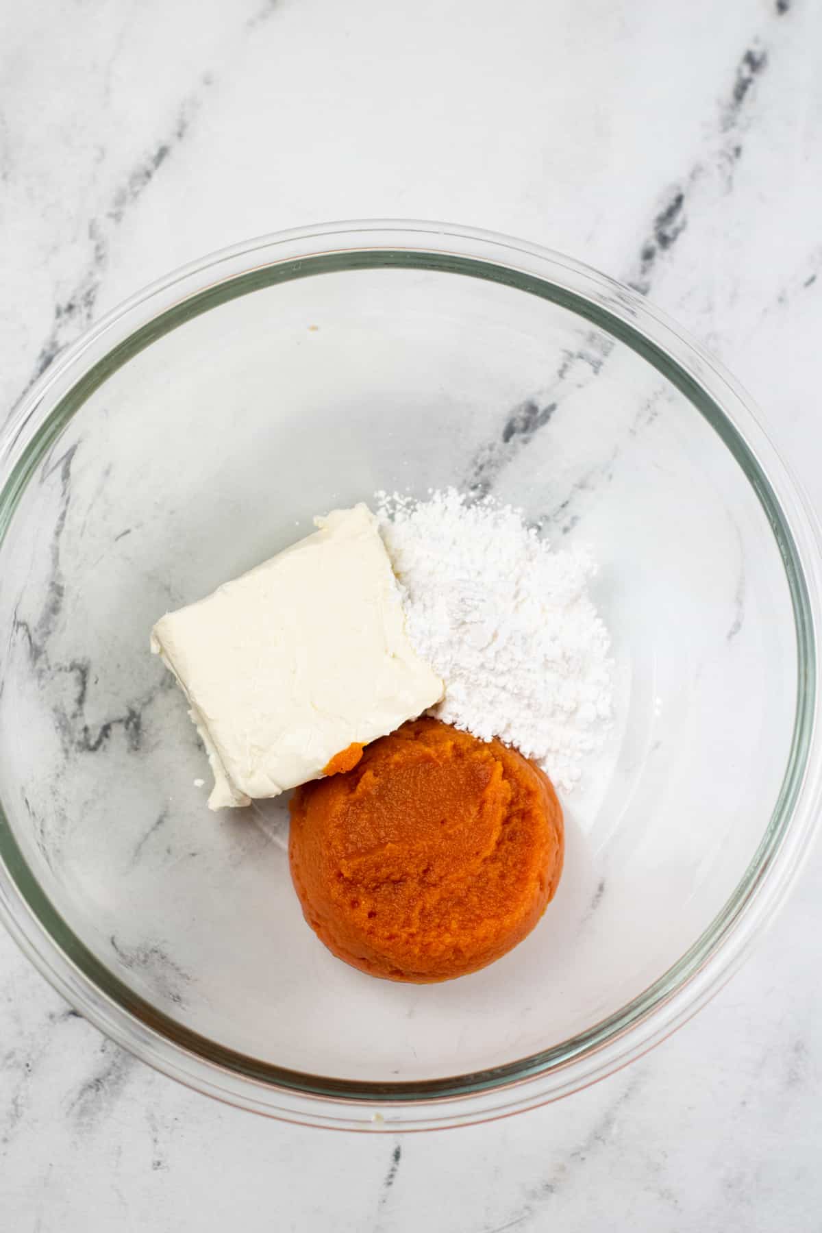 One process for making Pumpkin Truffles is to beat beat cream cheese and powdered sugar together until well blended.