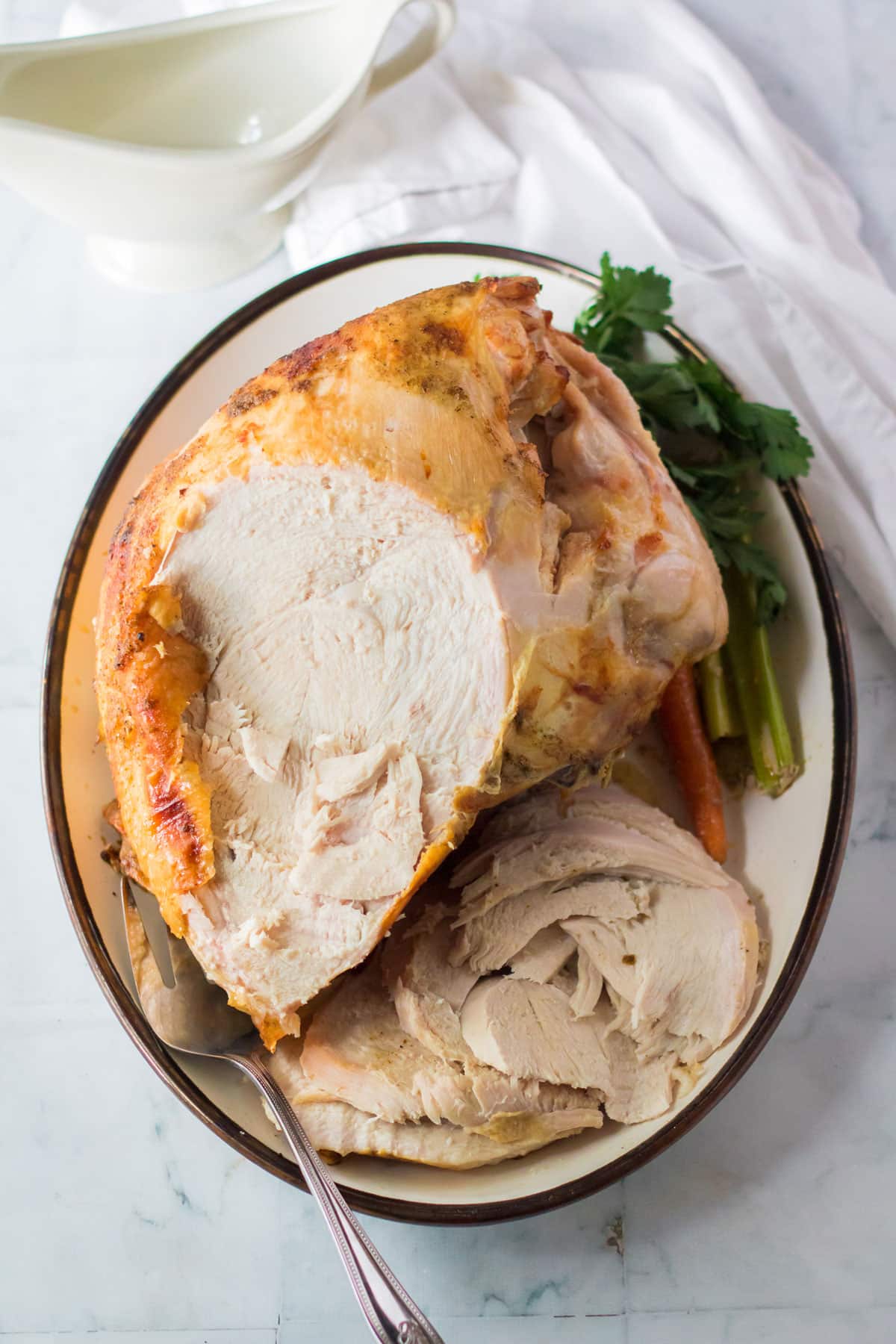 A plate of cooked Slow Cooker Turkey Breast with Vegetables