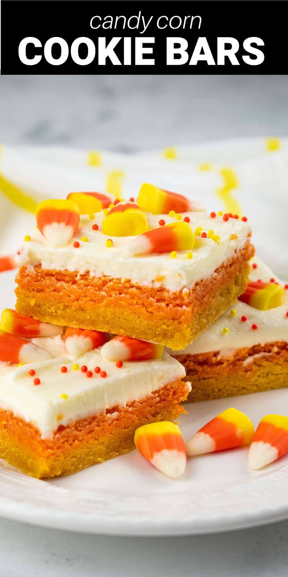 These candy corn cookie bars are a colorful and festive treat that deserves a top spot on your fall baking list. Layers of soft and chewy sugar cookie dough are topped with a creamy vanilla frosting and decorated with candy corn and sprinkles.