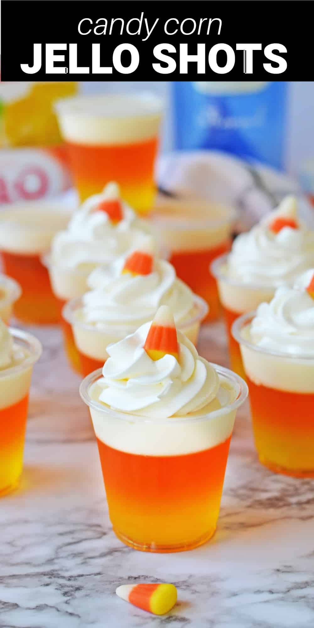 These Candy Corn Jello Shots are delicious and boozy treats with a fun and festive look. Gelatin layers in yellow, orange, and white make this shot resemble the candy corn treats that are so popular in the fall. They’re infused with whipped cream vodka, which adds a delicious and sweet whipped cream flavor to complement the fruity Jello. Then, they’re topped with fresh whipped cream and garnished with a candy corn for a cute finishing touch.