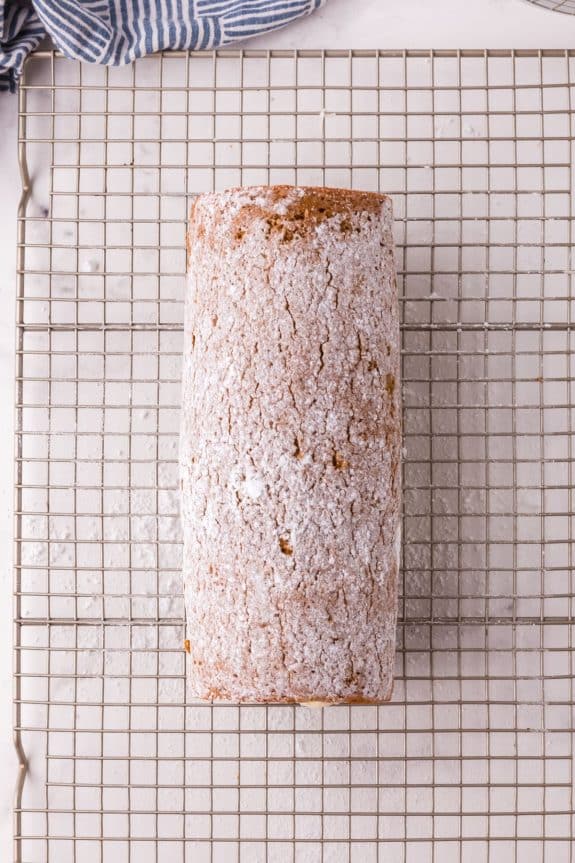 rolled cake with powdered sugar on top