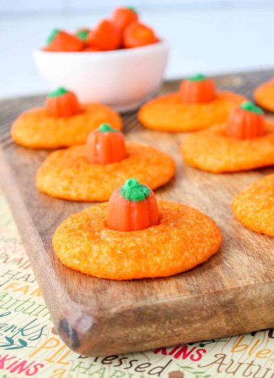 orange sanded sugar cookies with pumpkins on top