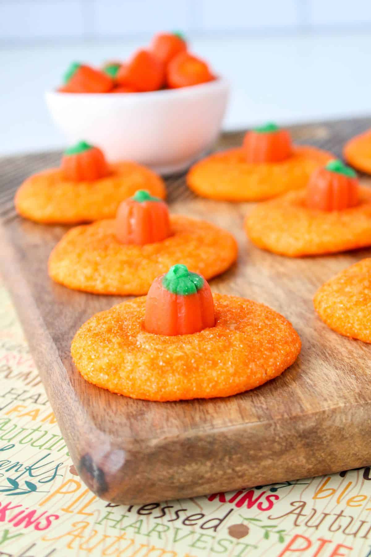 orange cookies with pumpkin candies on top