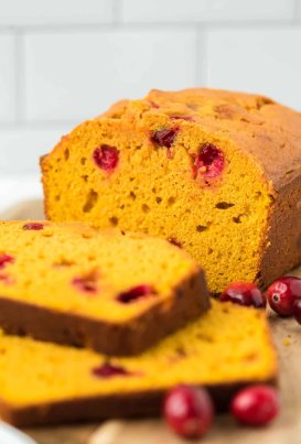sliced pumpkin bread with cranberries on the inside