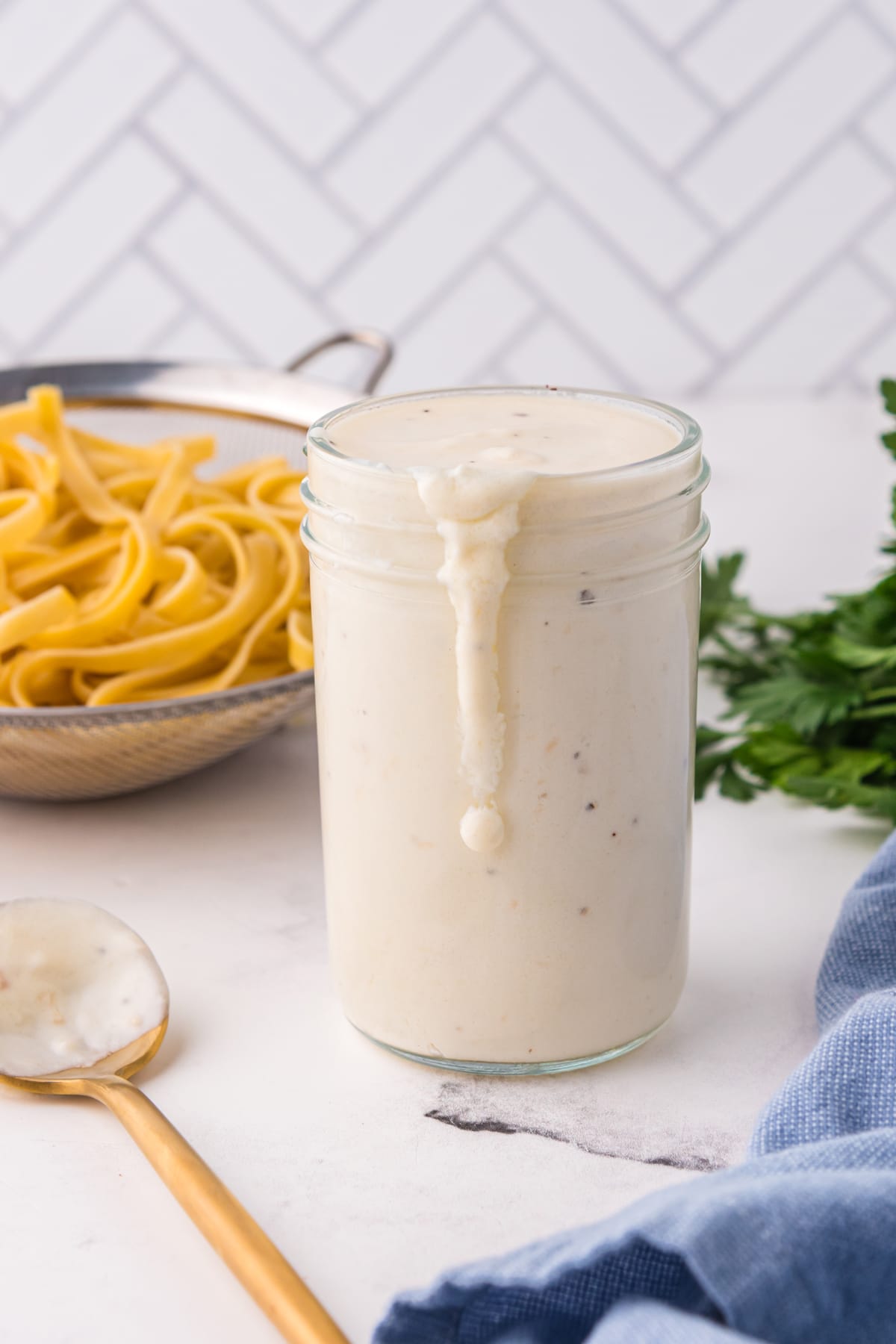 Homemade alfredo sauce is a combination of Unsalted butter, Garlic, minced (or you can use garlic powder), All-purpose flour, Heavy cream, Whole milk, Black pepper (you can also use white pepper), Fresh parmesan cheese, and shredded Pecorino Romano cheese