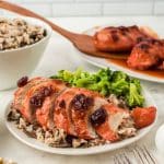 Cranberry Chicken Casserole servings on a white counter
