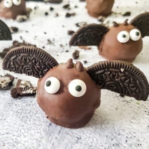 chocolate truffle with Oreo wings and two candy eyes