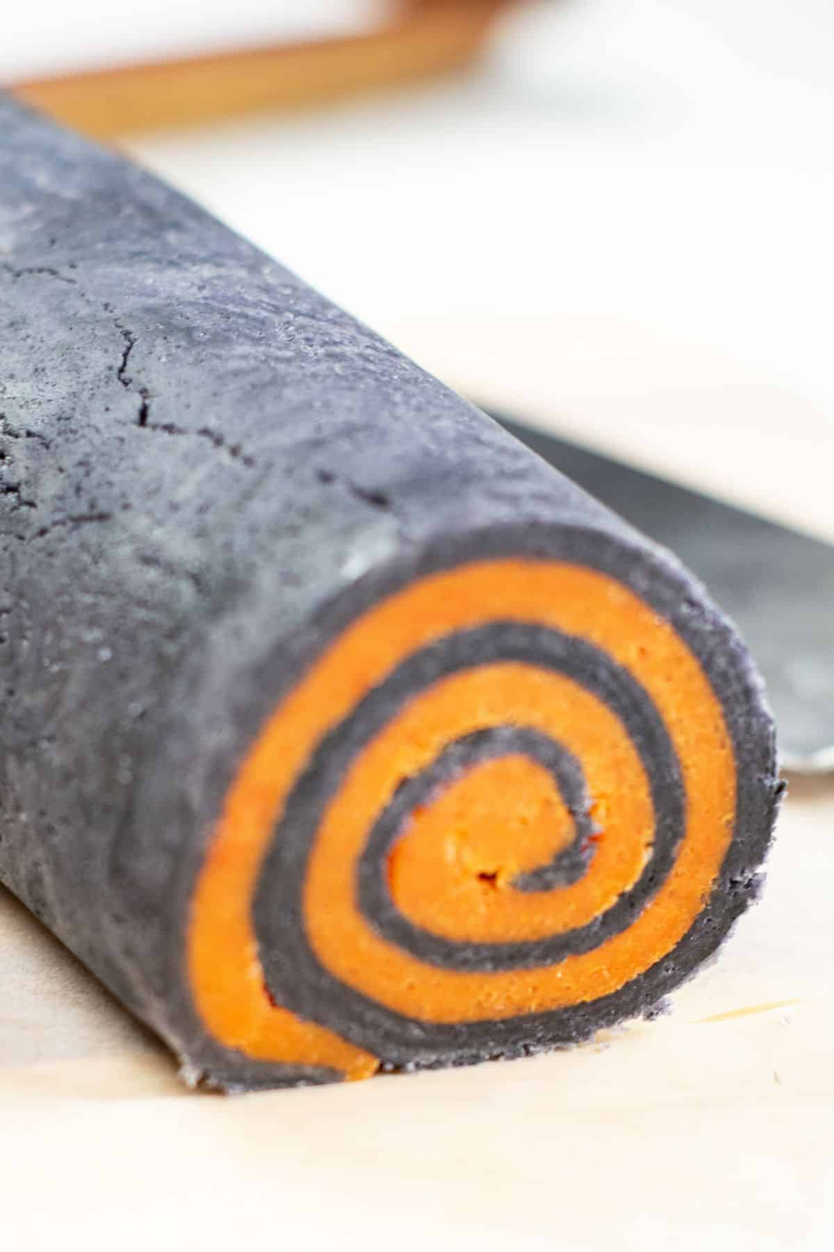 roll of orange and black cookie dough
