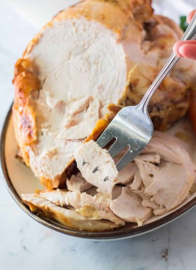 carved turkey on plate with fork