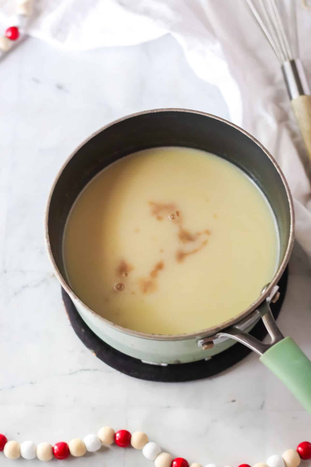 milk in sauce pan with extract
