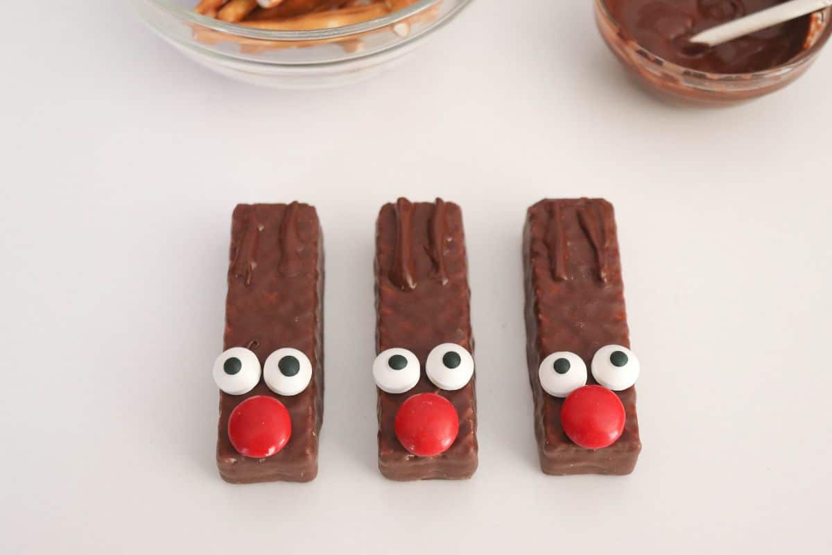 candy eyes and red nose on chocolate wafers