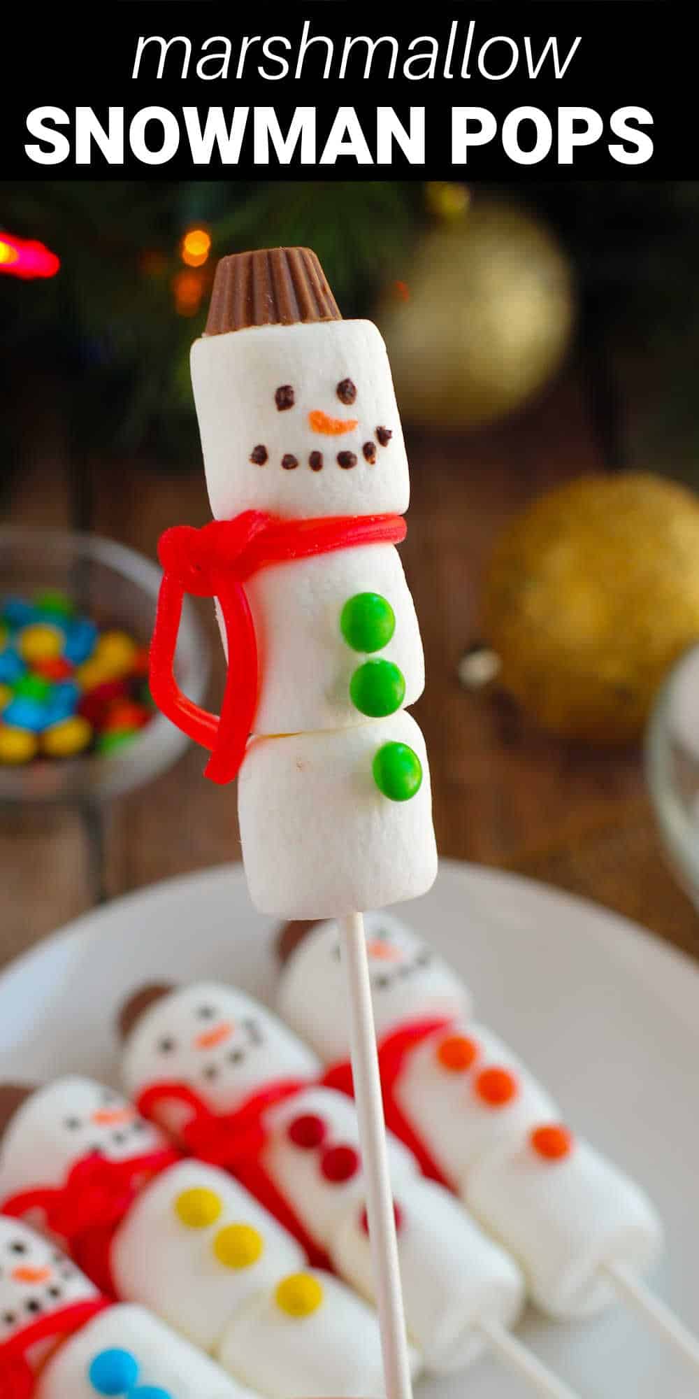 These cute snowman marshmallow pops are a fun and festive treat that the whole family will enjoy making. Marshmallow “snowballs” are placed on lollipop sticks and decorated with chocolate and candy to transform them into adorable snowmen. They’re just as much fun to make as real snowmen, and a whole lot tastier!