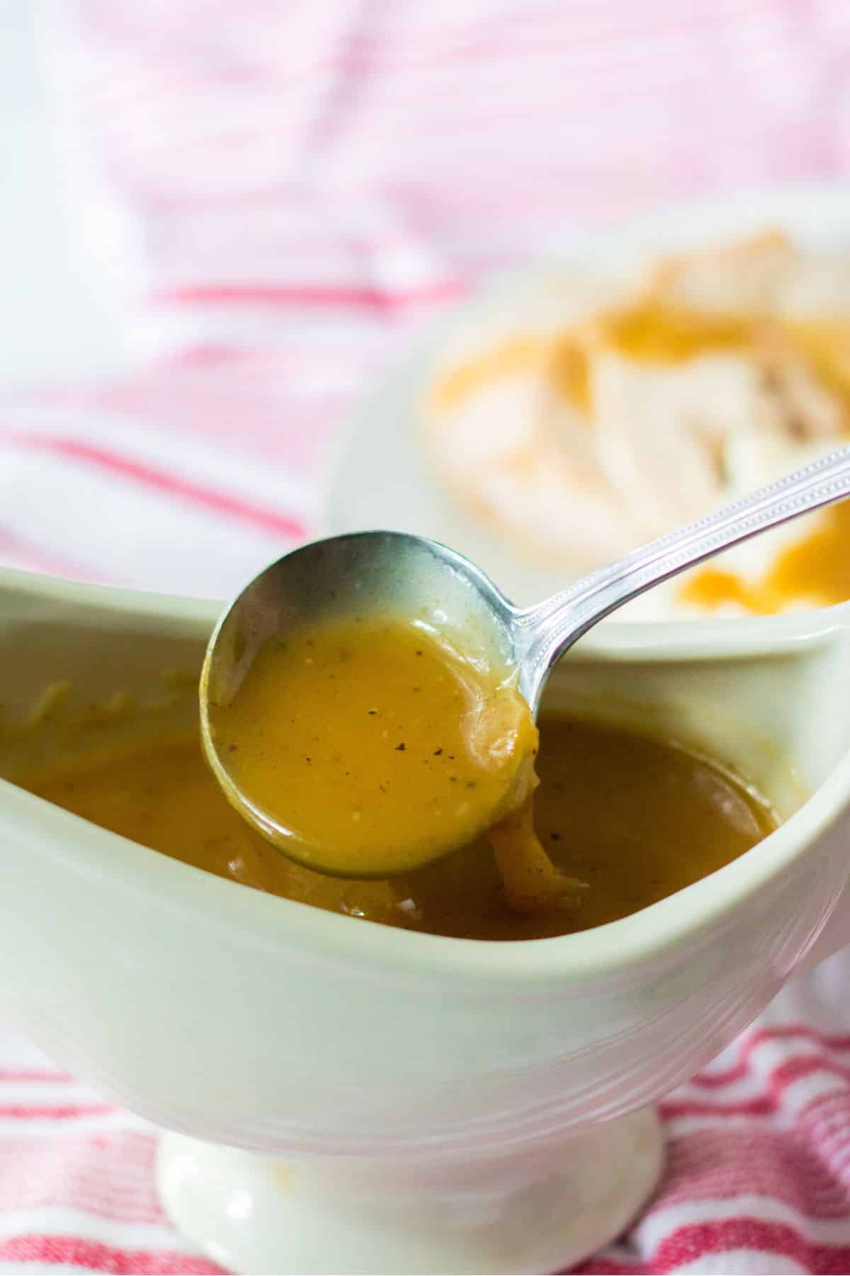 spoon pouring thickened turkey gravy