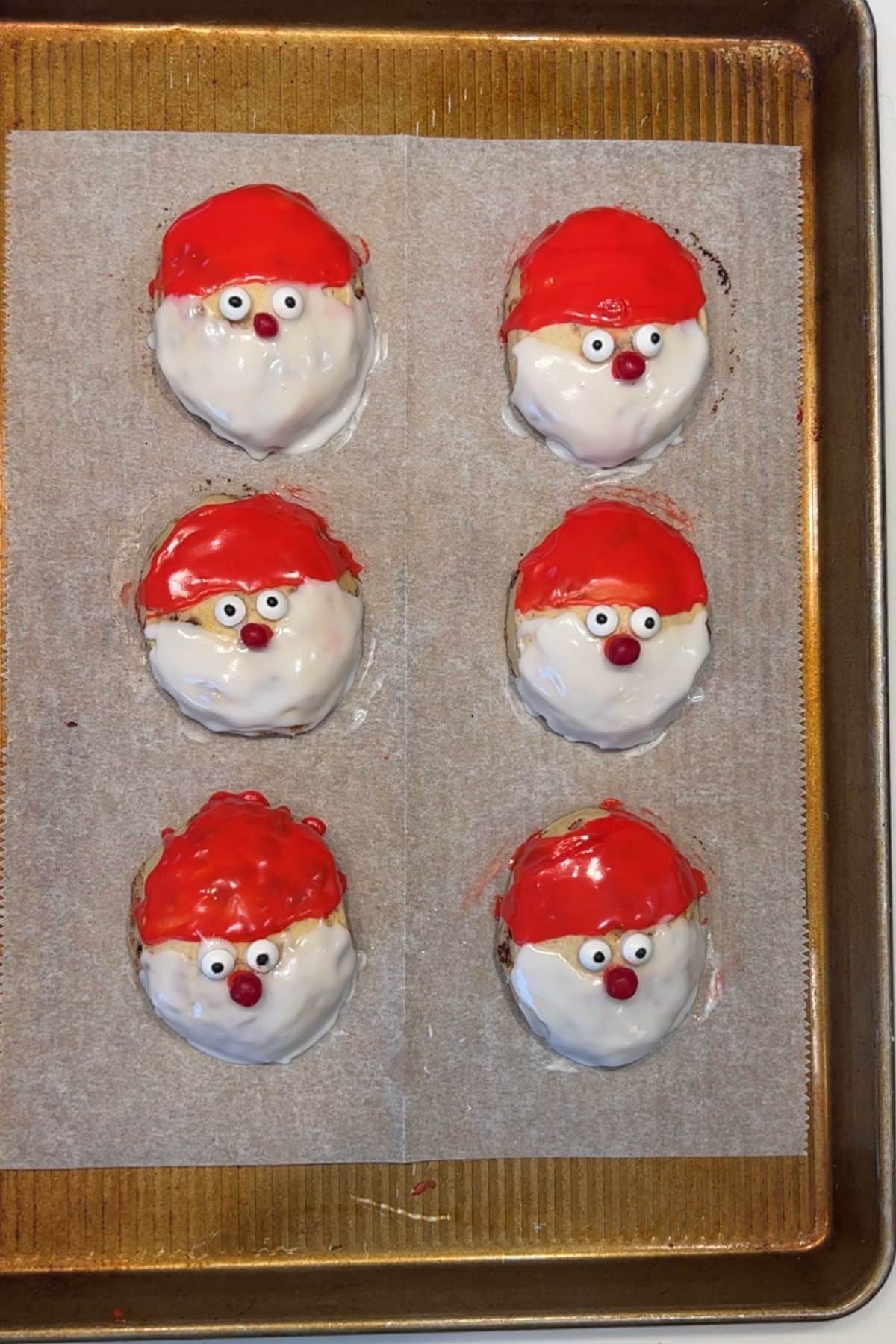 candy eyes and red nose on cinnamon rolls