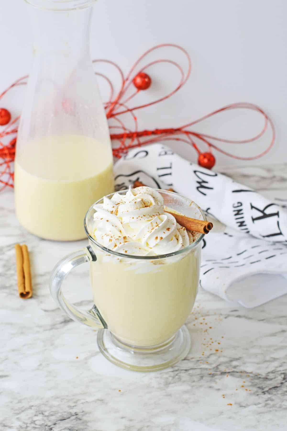 glass of egg nog with whipped cream