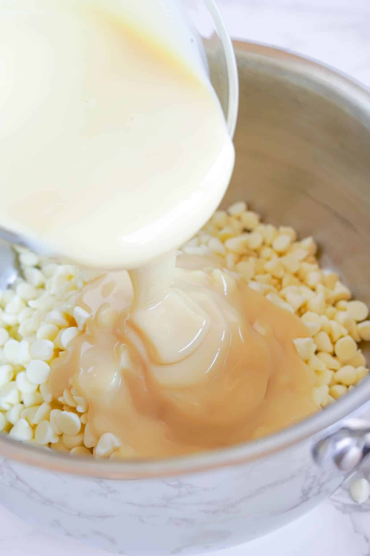 pour condensed milk on white chocolate chips