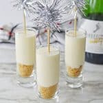 Champagne Cheesecake Shooters on a marble counter
