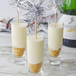Champagne Cheesecake Shooters on a marble counter