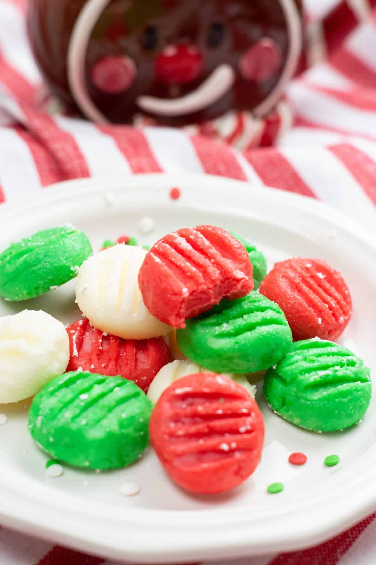 red, green, and white round mints on plate