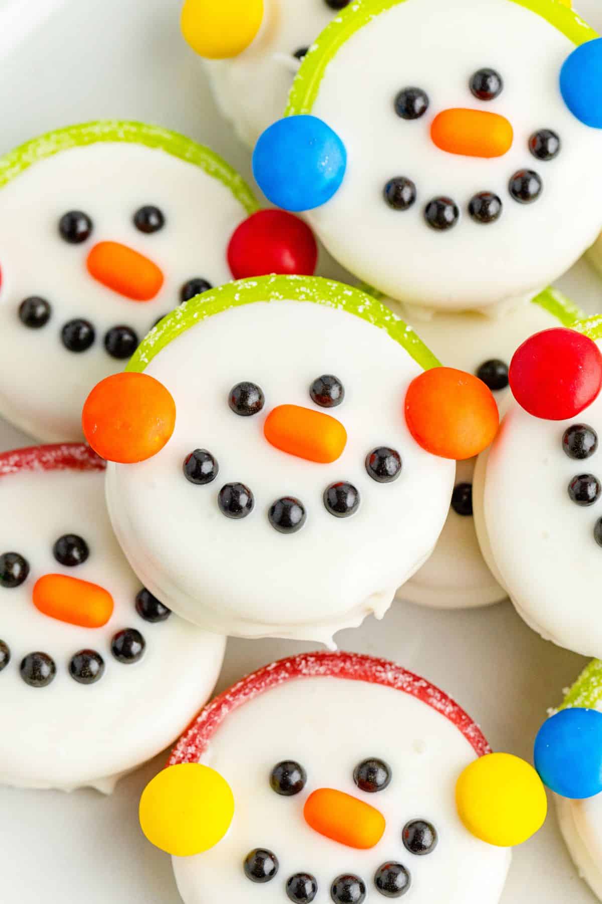 round snowman faces with colorful earmuffs