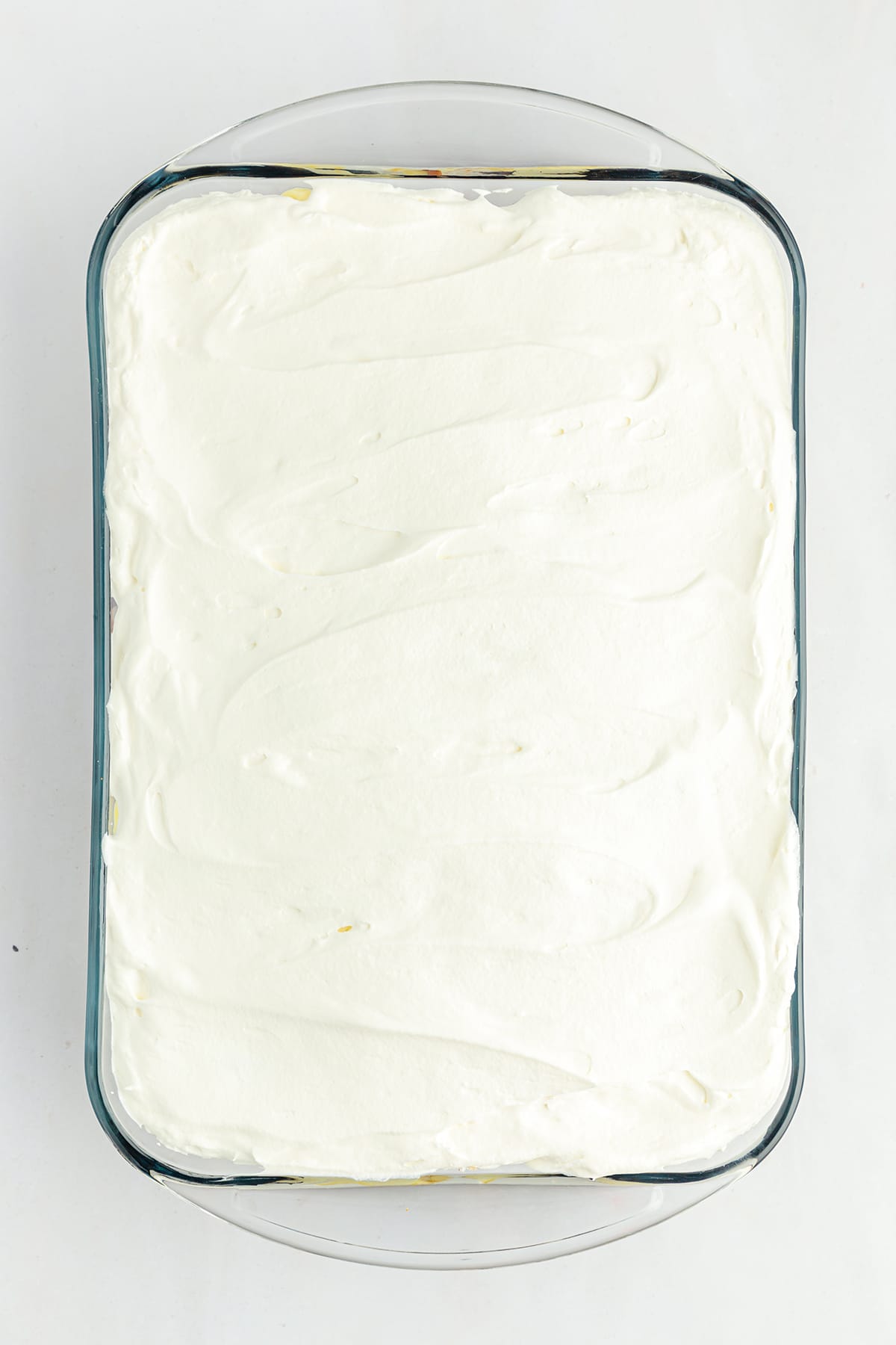 additional layer of well distributed whipped cream on the pan