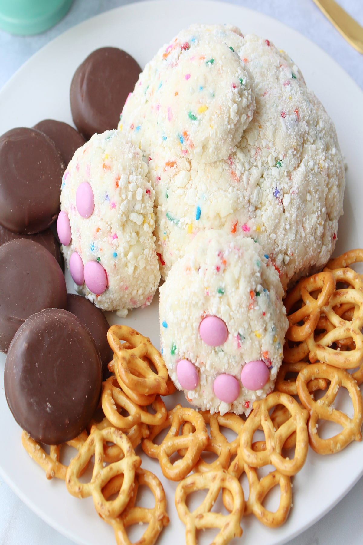 Shaped bunny cookie dip with side pretzel and chocolate 