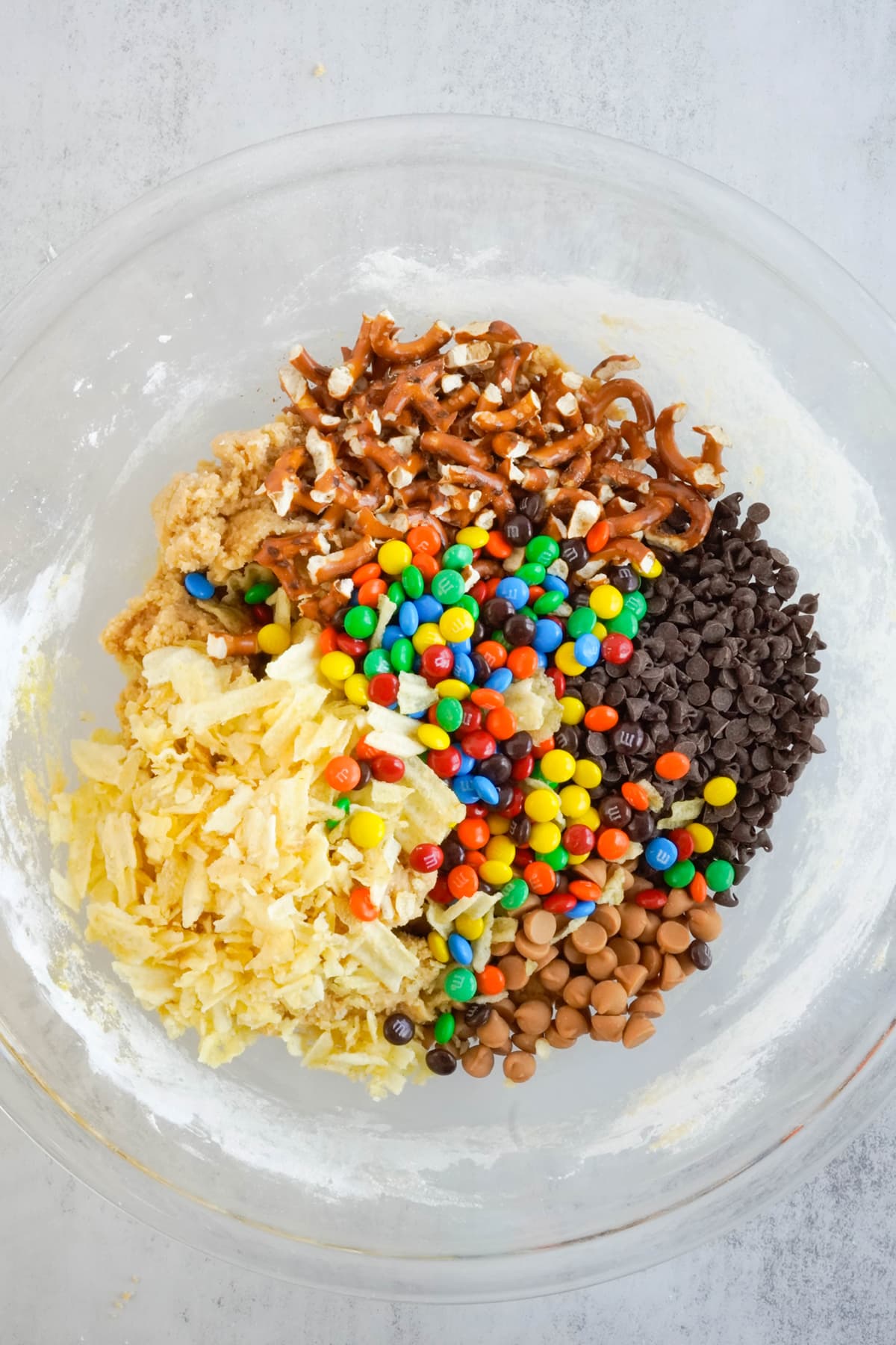 Chips and candies on top of the cookie dough