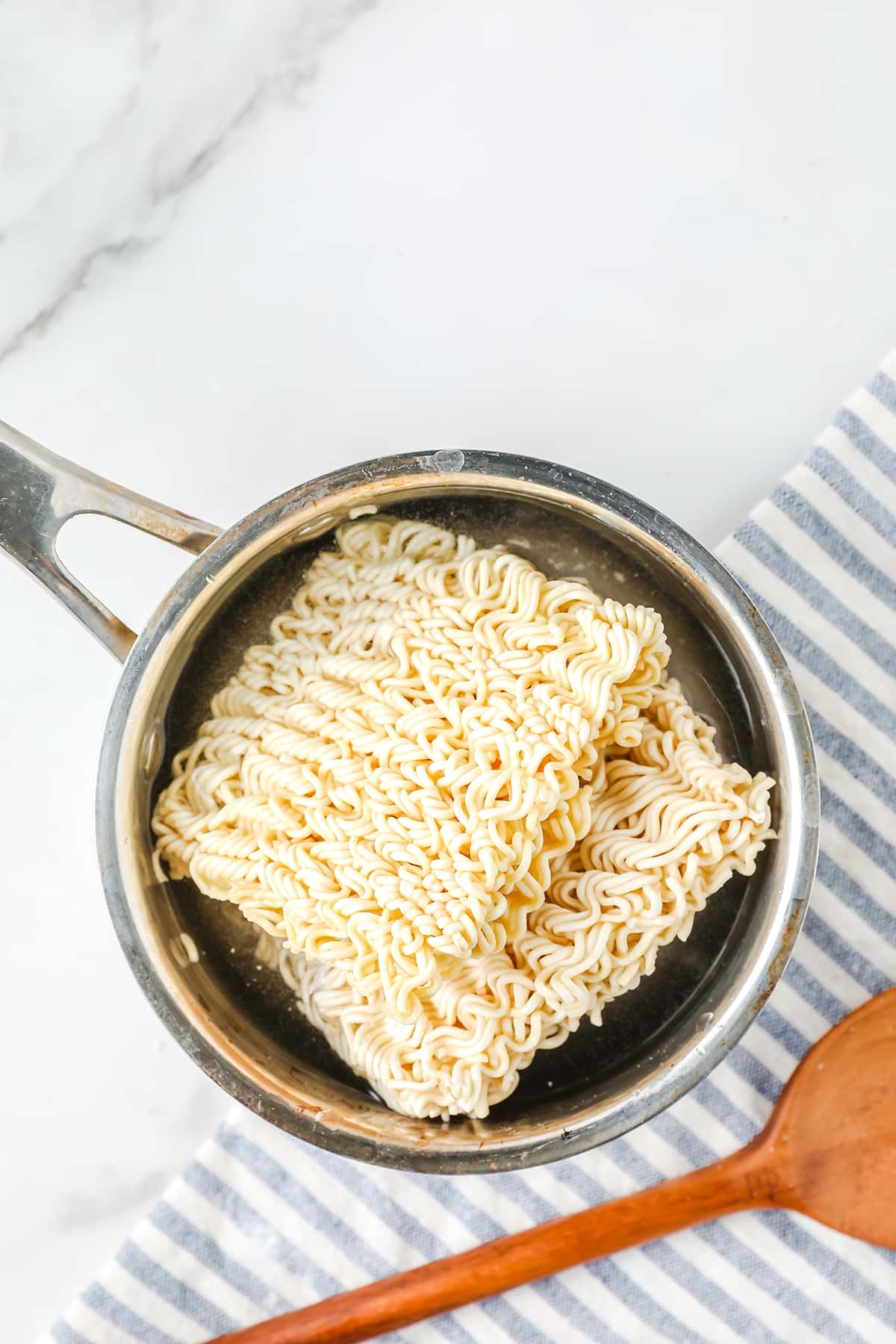 Ramen noodles in a saucepan with water