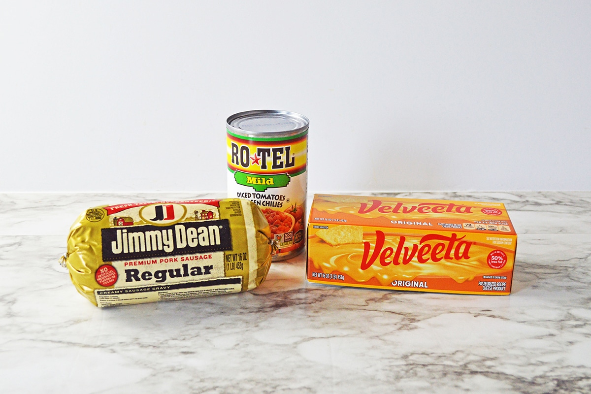 Can of Rotel tomatoes, sausage and box of velveeta cheese